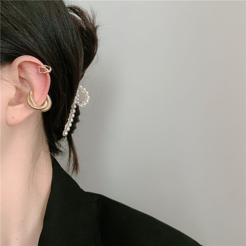 Fashion Geometric Cross Metal Winding Alloy Earrings Wholesale