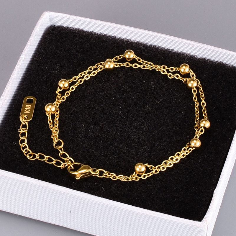 Koreanische Doppelkugel Kleine Kugel Gold Perle Titan Stahl Armband Großhandel