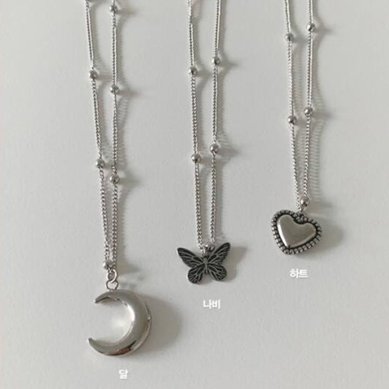 Großhandel Schmuck Retro Mond Schmetterling Herz Anhänger Halskette 3-teiliges Set Nihaojewelry