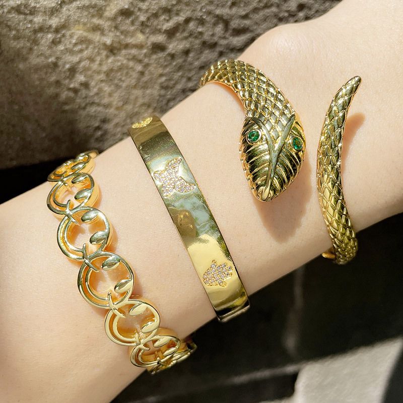 Großhandel Schmuck Hohles Lächeln Gesicht Schlangenform Eingelegtes Zirkonarmband Nihaojewelry