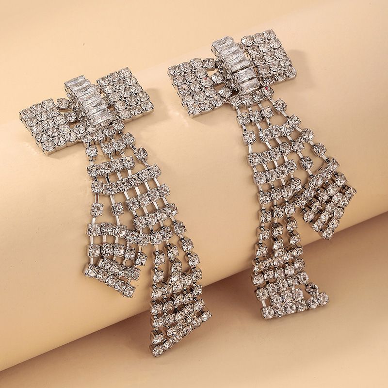 Nihaojewelry المجوهرات بالجملة الأزياء مطعمة حجر الراين الزركون القوس أقراط