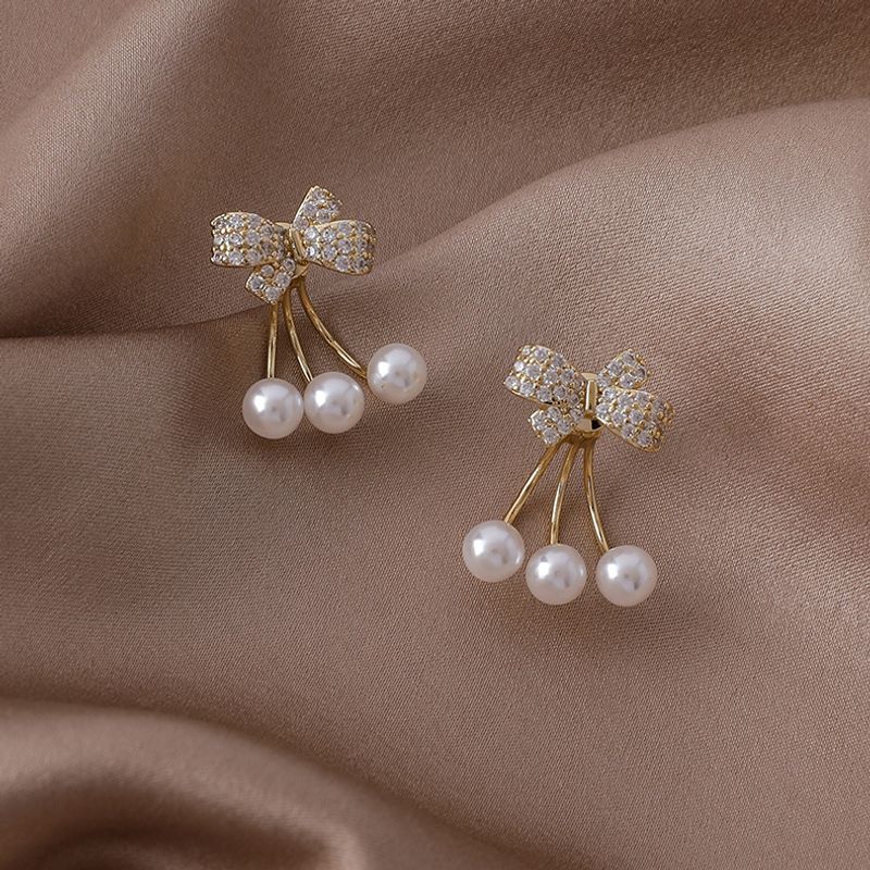 Vente En Gros Boucles D&#39;oreilles En Cuivre Perle Bowknot Zircon Micro-incrusté Nihaojewelry