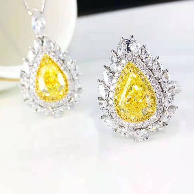The New Luxury Water Drop Pear-shaped Yellow Diamond Pendant Is Micro-studded With Diamond Pink Crystal Stud Earrings Open Ring Caibao Necklace Set