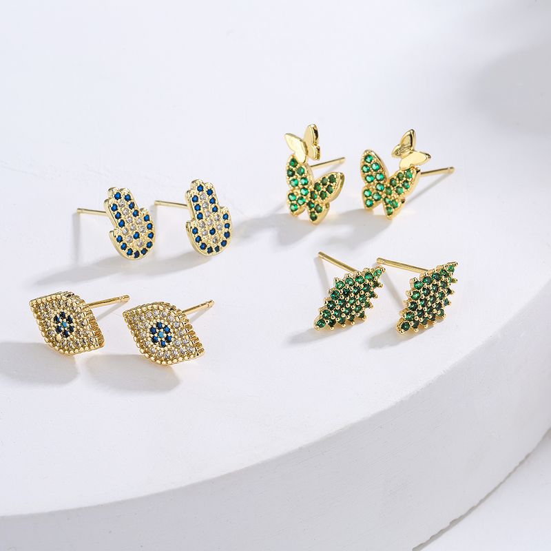 Nouveau Style De Cuivre Plaqué Or Micro Incrusté Zircon Yeux Papillon Palm Boucles D'oreilles