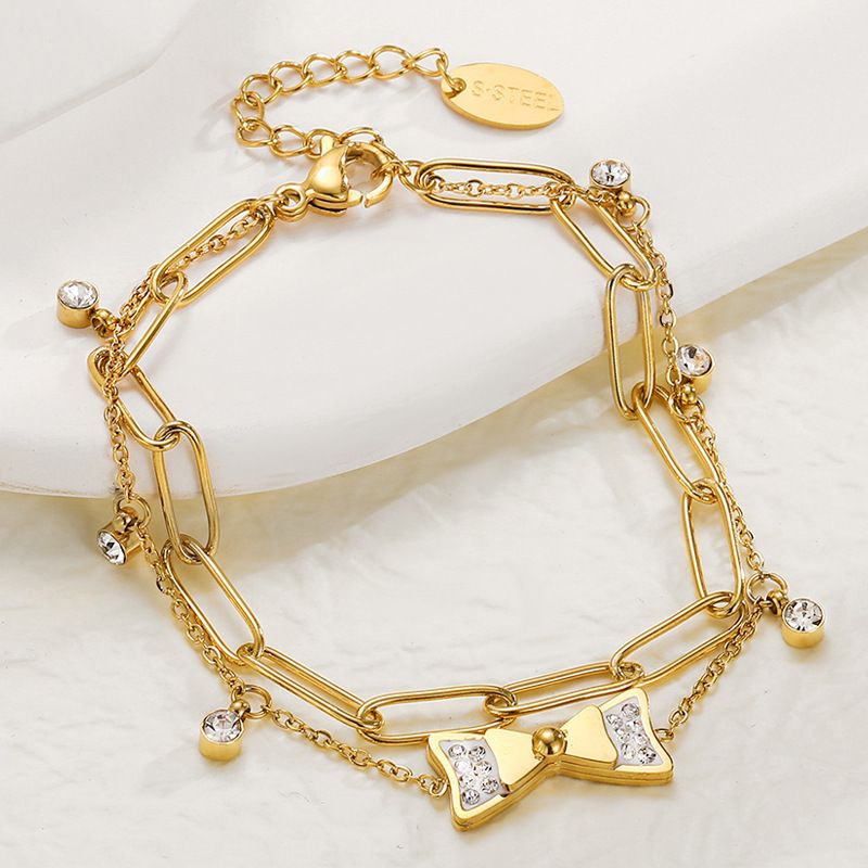 Mode Zirkon Intarsien Bogen Anhänger 14k Gold Überzogene Titan Stahl Armband