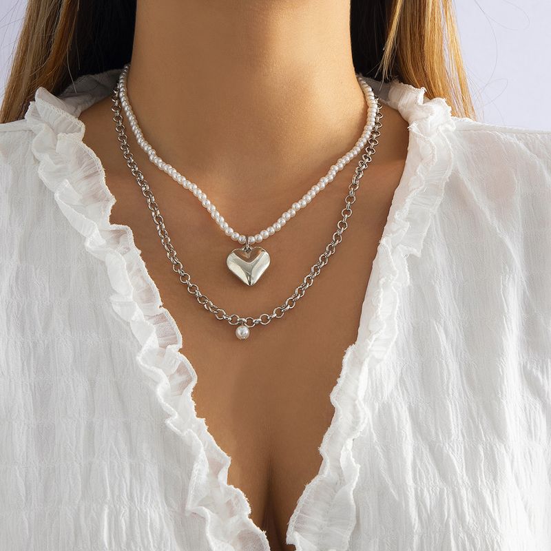 Mode Retro Nachahmung Perle Doppel-schicht Geometrische Herz Form Hohl Harz Metall Halskette Set
