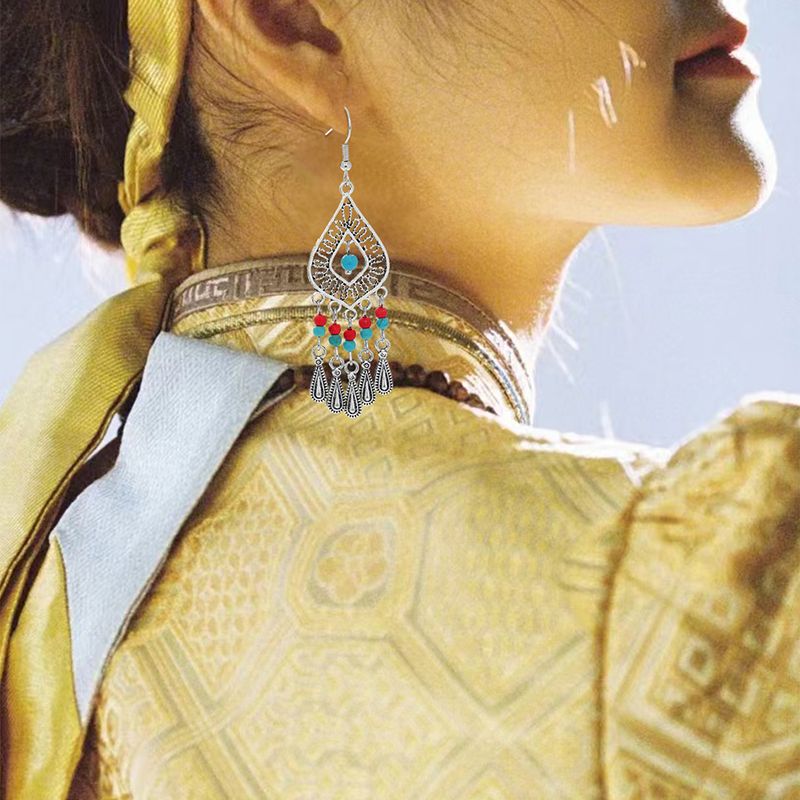 Femmes Style Ethnique Gland Alliage Boucles D'oreilles Inlay Turquoise Boucles D'oreilles Comme Image