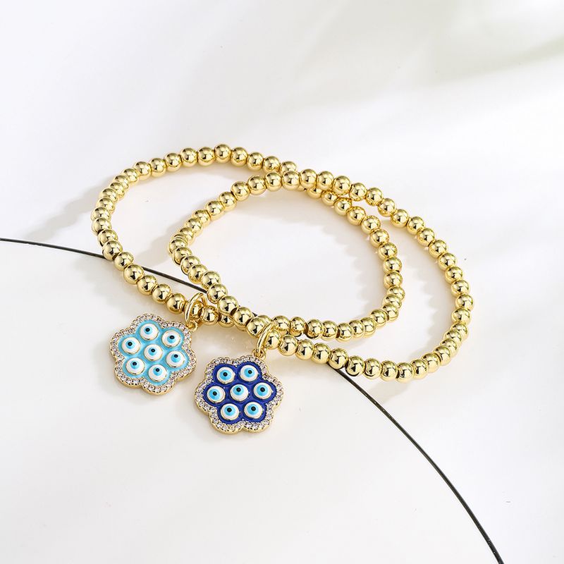 New Style Copper Plated 18k Gold Zirconia Oil Drop Blue Eye Flower Bracelet