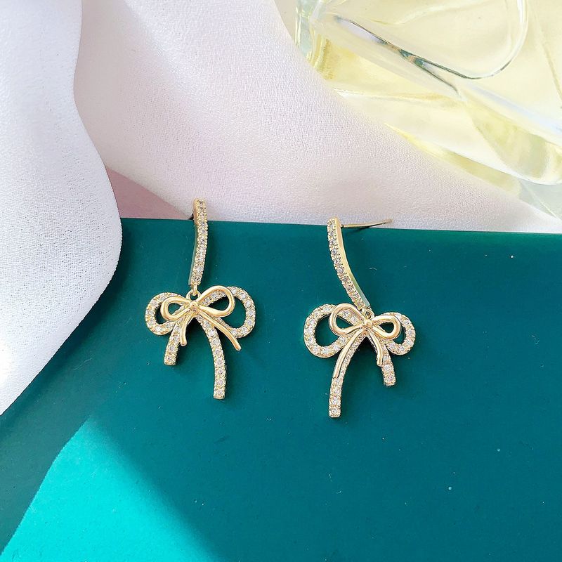 Simple Style Bow Shape Tassel Copper Inlaid Zircon Earrings