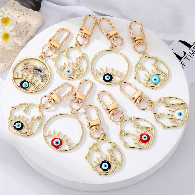 Fashion Alloy Hollow Dripping Keychain Round Geometric Blue Eyes Bag Pendant Accessories