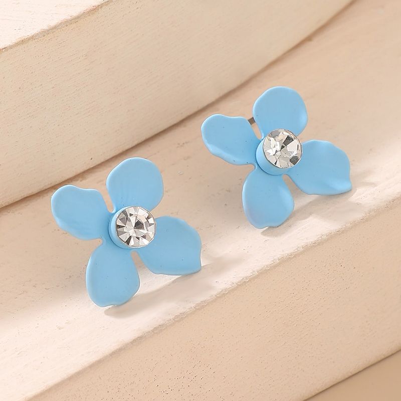 Nouveau Style Simple Bleu Peint Quatre Feuille Fleur Boucles D'oreilles