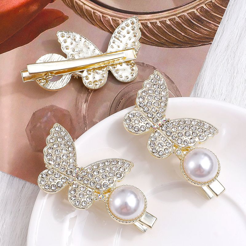 Mujeres Moda Mariposa Aleación Accesorios Para El Cabello Perla Diamante Diamantes De Imitación Pinza Para El Cabello 1 Juego