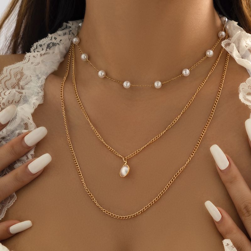 Bijoux En Gros Style Ethnique Style Simple Géométrique Le Fer Le Cuivre Perles Artificielles Gland Collier