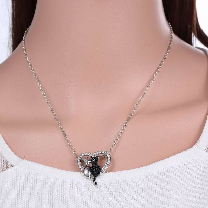 Fashion Ornament Black And White Cat Heart Shaped Pendant Alloy Necklace