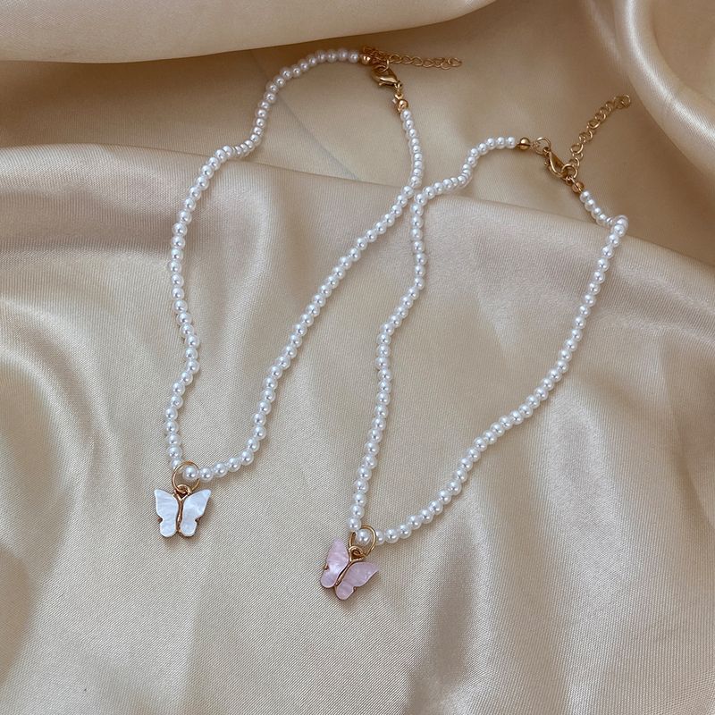 Simple Style Bow Knot Imitation Pearl Inlay Shell Necklace