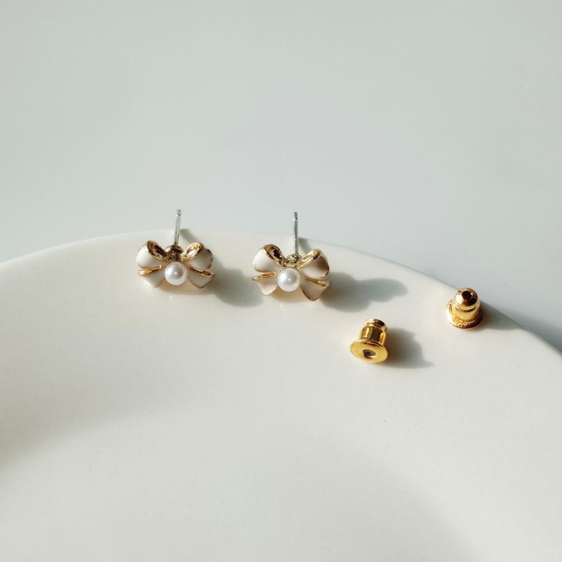 Simple Style Bow Knot Alloy Enamel Artificial Pearls Ear Studs