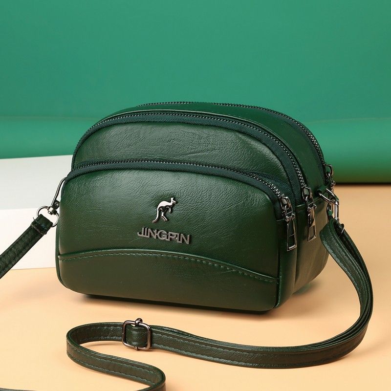 Women's Medium Pu Leather Solid Color Fashion Oval Zipper Crossbody Bag