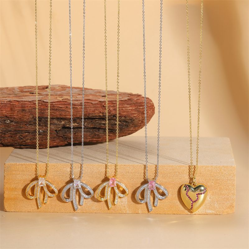 Einfacher Stil Herzform Bogenknoten Kupfer Überzug Kette Inlay Zirkon 14 Karat Vergoldet Weißgold Plattiert Halskette Mit Anhänger