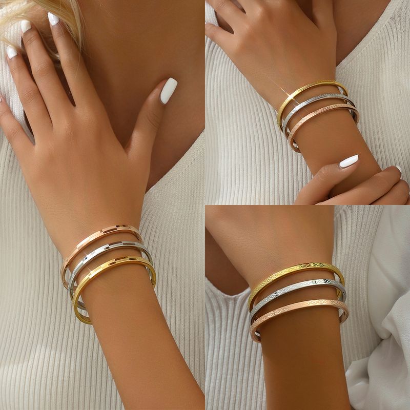 Casual Básico Estilo Simple Color Sólido Acero Inoxidable 201 Chapados en oro de 18k Brazalete Al Mayoreo