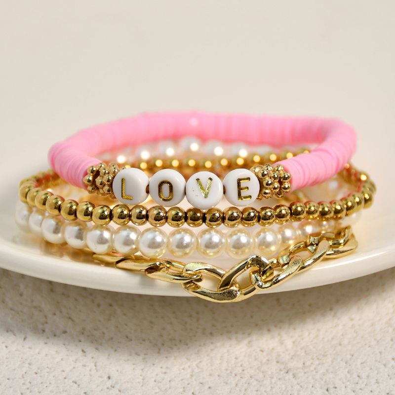 Casual Vacation Letter Artificial Pearl Alloy Soft Clay Beaded Gold Plated Women's Bracelets