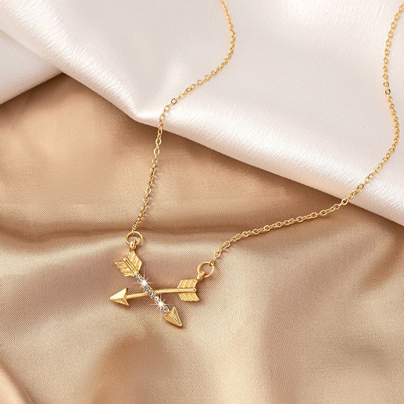 Simple Style Bow And Arrow Alloy Plating Inlay Rhinestones Gold Plated Women's Pendant Necklace