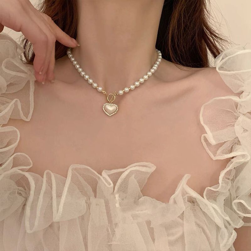 Elegante Forma De Corazón Perla De Imitación Aleación Con Cuentas Enchapado Embutido Diamantes De Imitación Perla Mujeres Collar Colgante