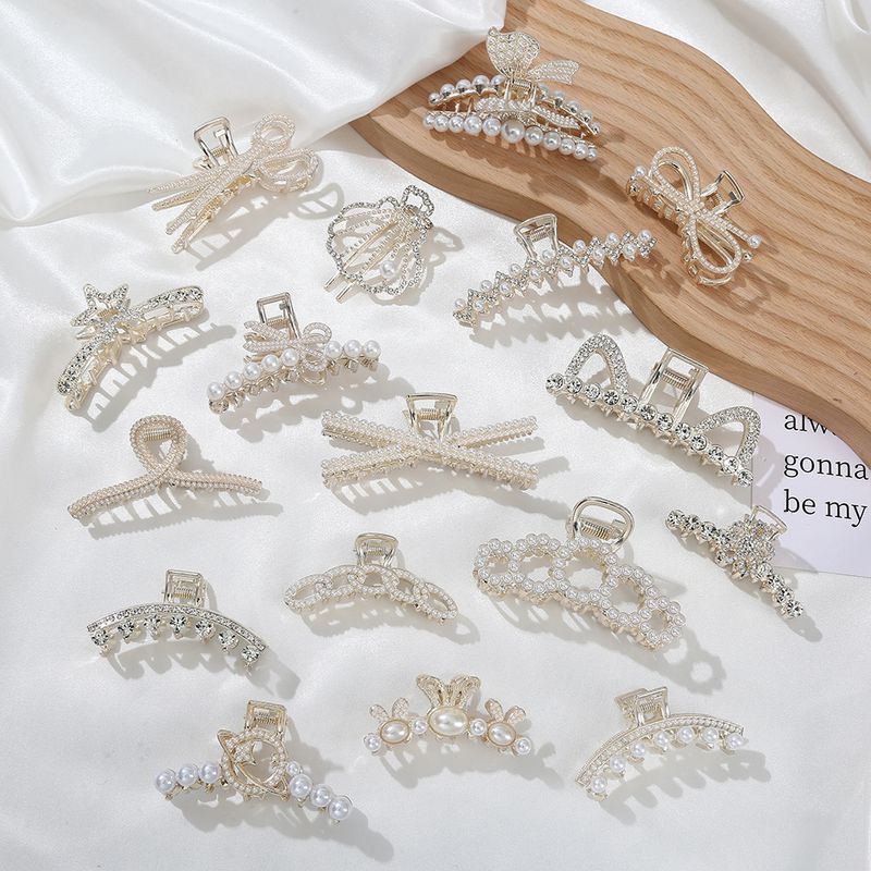 Elegant Star Bow Knot Shell Alloy Plating Hollow Out Inlay Rhinestones Pearl Hair Claws