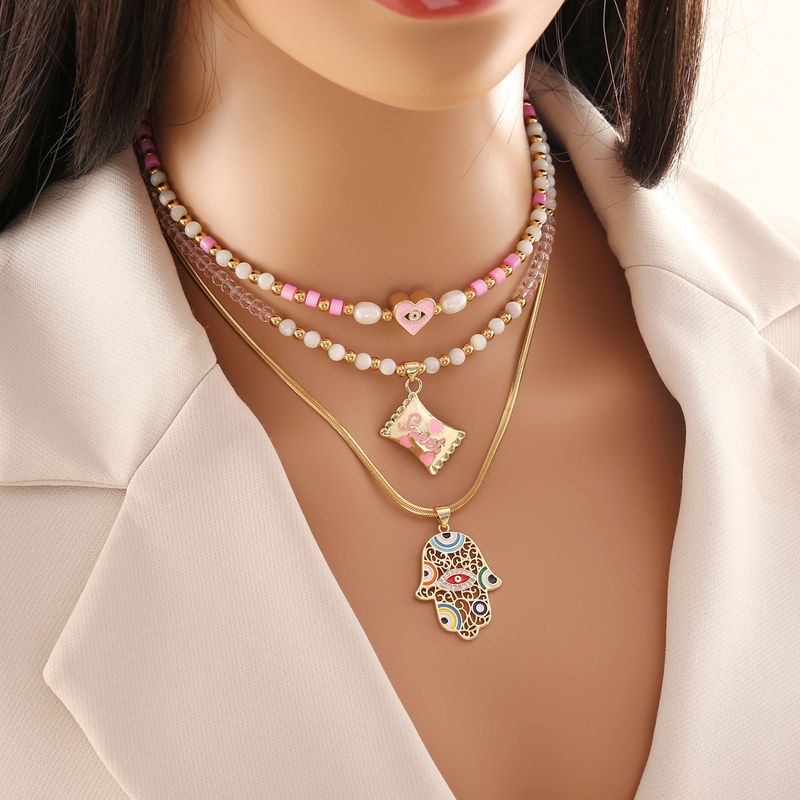 1 Piece Vacation Devil's Eye Hand Heart Shape Imitation Pearl Shell Beaded Women's Pendant Necklace