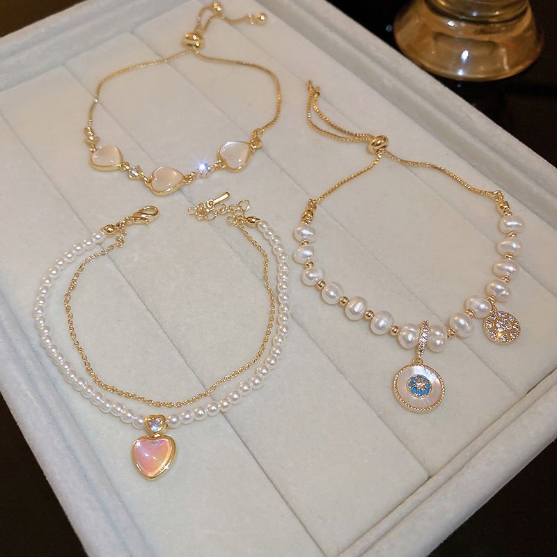 Elegant Heart Shape Flower Shell Mixed Materials Plating Inlay Rhinestones Opal Zircon Women's Bracelets