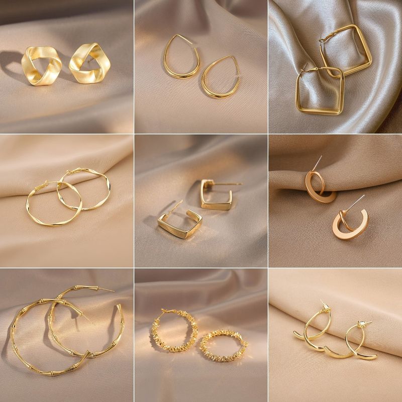 Wholesale Jewelry 1 Pair Simple Style Heart Shape Solid Color Twist Metal Zircon Earrings Ear Studs