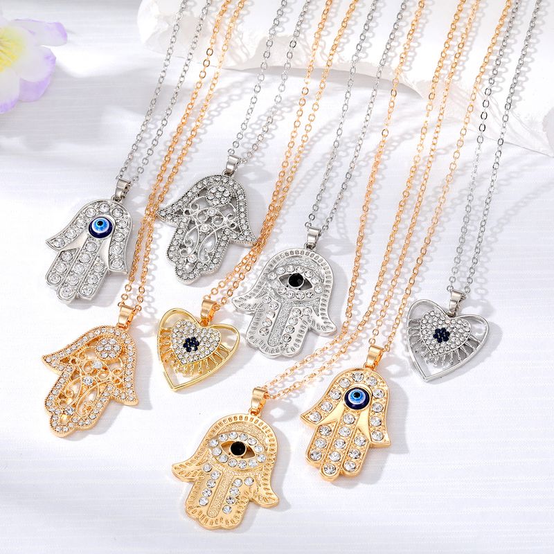 Casual Cool Style Devil's Eye Palm Heart Shape Alloy Hollow Out Inlay Rhinestones Women's Pendant Necklace