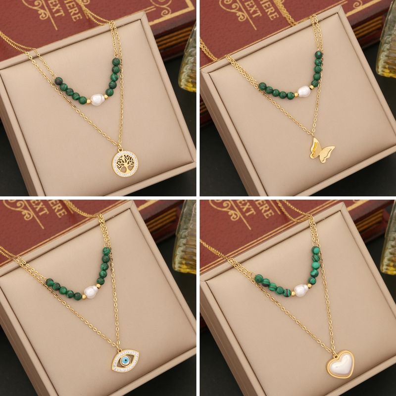 Venta Al Por Mayor Retro Árbol Forma De Corazón Ojo Acero Inoxidable Malaquita Embutido Chapados en oro de 18k Diamante Artificial Perla Collares En Capas