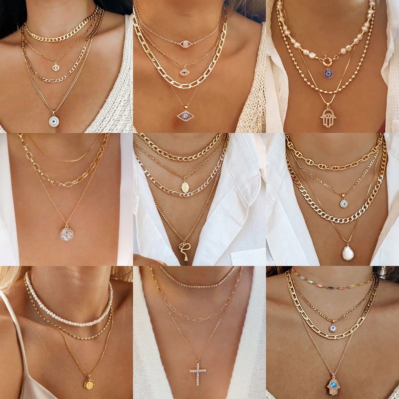 Hip-hop Retro Cross Devil's Eye Palm Gold Plated Artificial Pearls Rhinestones Alloy Wholesale Layered Necklaces