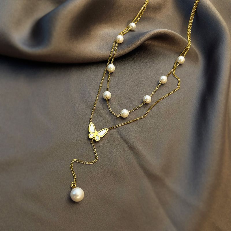 Acero Titanio Chapados en oro de 18k Elegante Sexy Enchapado Embutido Mariposa Perlas Artificiales Cascarón