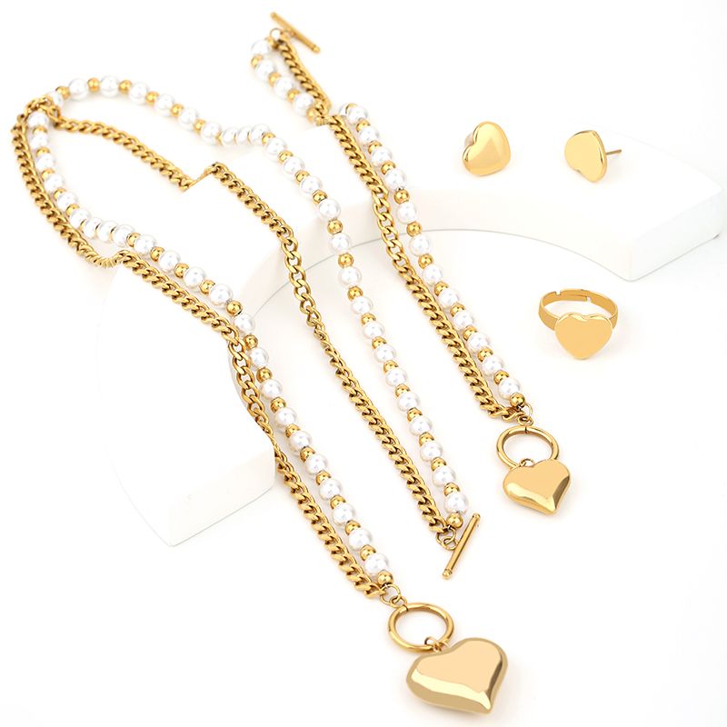 Großhandel Retro Römischer Stil Herzform Titan Stahl Ringe Ohrringe Halskette