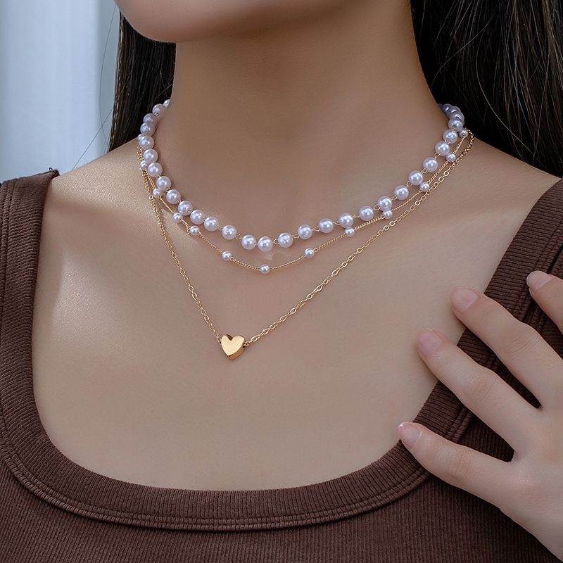 Elegant Einfacher Stil Herzform Kunststoff Zinklegierung Frau Dreilagige Halskette