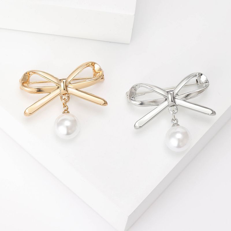 Élégant Style Simple Noeud D'arc Alliage Placage Incruster Perles Artificielles Femmes Broches
