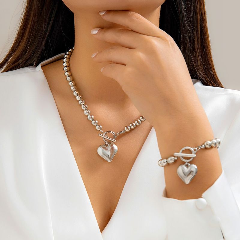 Einfacher Stil Herzform Imitationsperle Kupfer Frau Armbänder Halskette