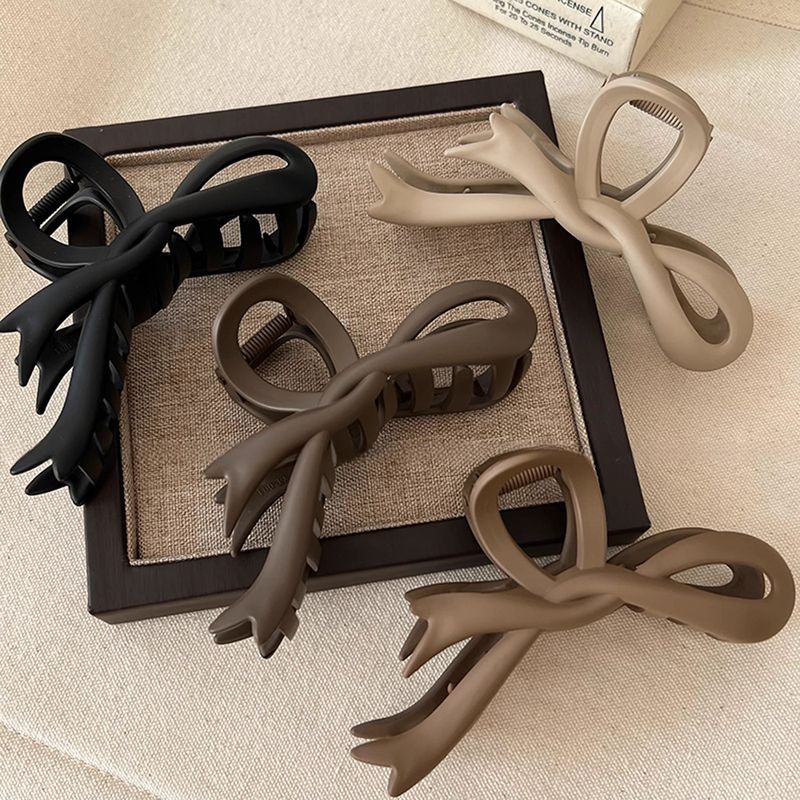 Women's Simple Style Bow Knot Arylic Hollow Out Hair Claws