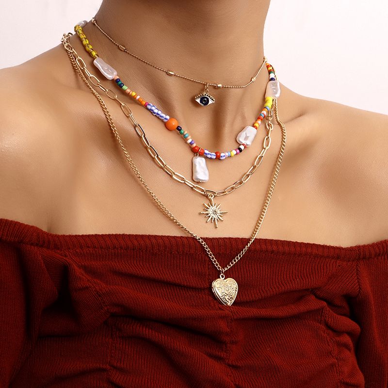 Casual Hip-Hop Devil's Eye Heart Shape Beaded Alloy Women's Layered Necklaces
