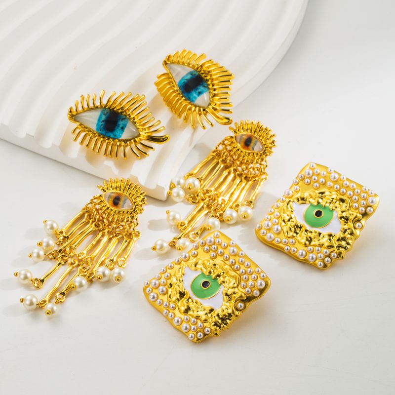 1 Paar Elegant Luxuriös Auge Überzug Inlay Zinklegierung Harz Perle Vergoldet Ohrstecker