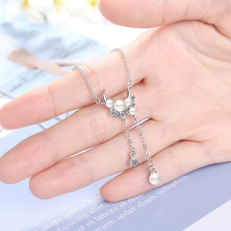 Estilo IG Señora Estilo Simple Estrella Luna Perla Artificial Cobre Enchapado Embutido Diamantes De Imitación Mujeres Collar Colgante