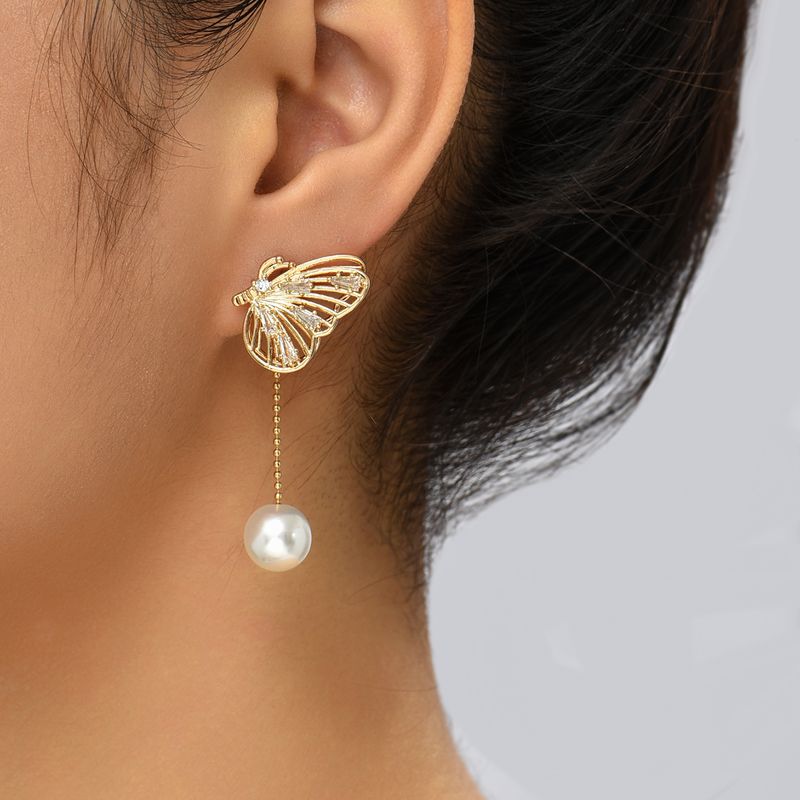 1 Pair IG Style Exaggerated Simple Style Butterfly Hollow Out Inlay Artificial Pearl Copper Zircon Drop Earrings