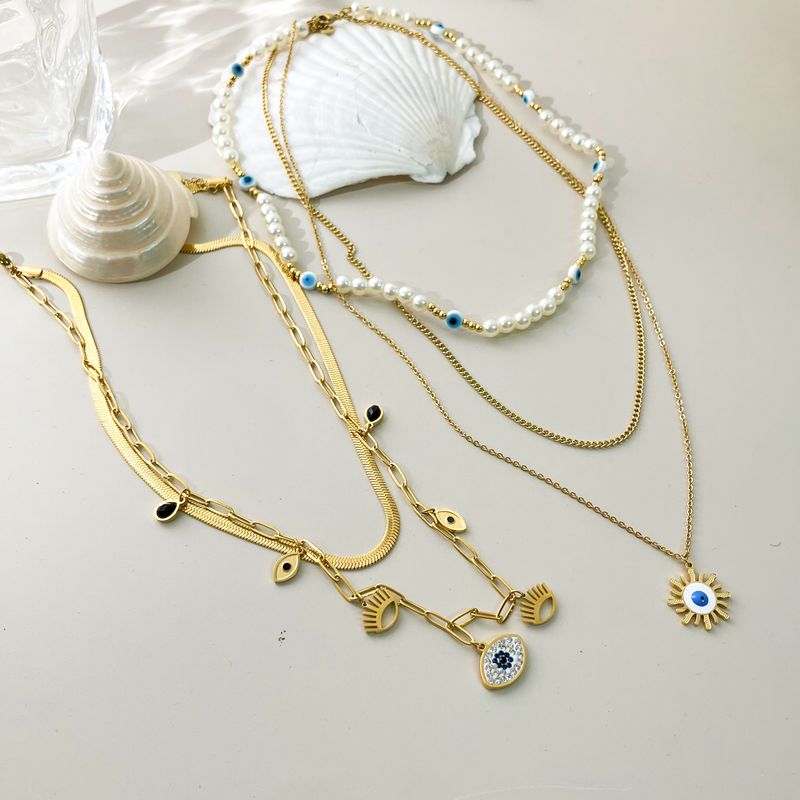 304 Stainless Steel Gold Plated Vacation Tropical Sweet Layered Pearl Inlay Sun Devil's Eye Zircon Layered Necklaces