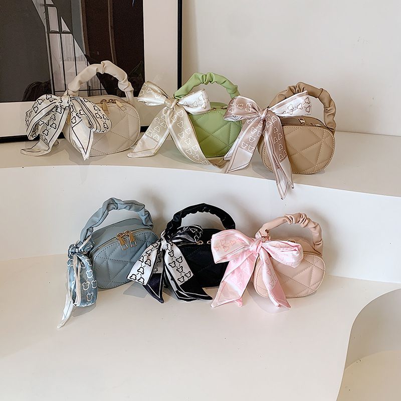 Women's Small Pu Leather Solid Color Cute Ribbon Oval Zipper Handbag