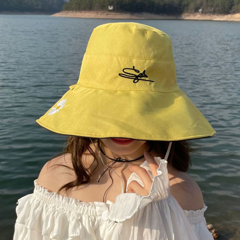 Mujeres Vacaciones Estilo Simple Color Sólido Crisantemo Aleros Anchos Sombrero De Copa