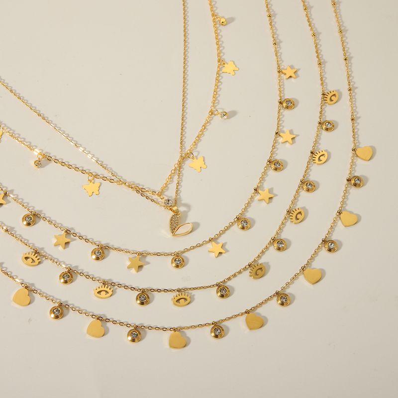 Acero Inoxidable 304 Chapados en oro de 18k Casual Estilo Vintage Embutido Estrella Ojo Mariposa Circón Collar Colgante