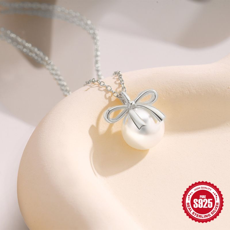 Sterling Silber Süss Einfacher Stil Überzug Inlay Bogenknoten Künstliche Perlen Halskette Mit Anhänger