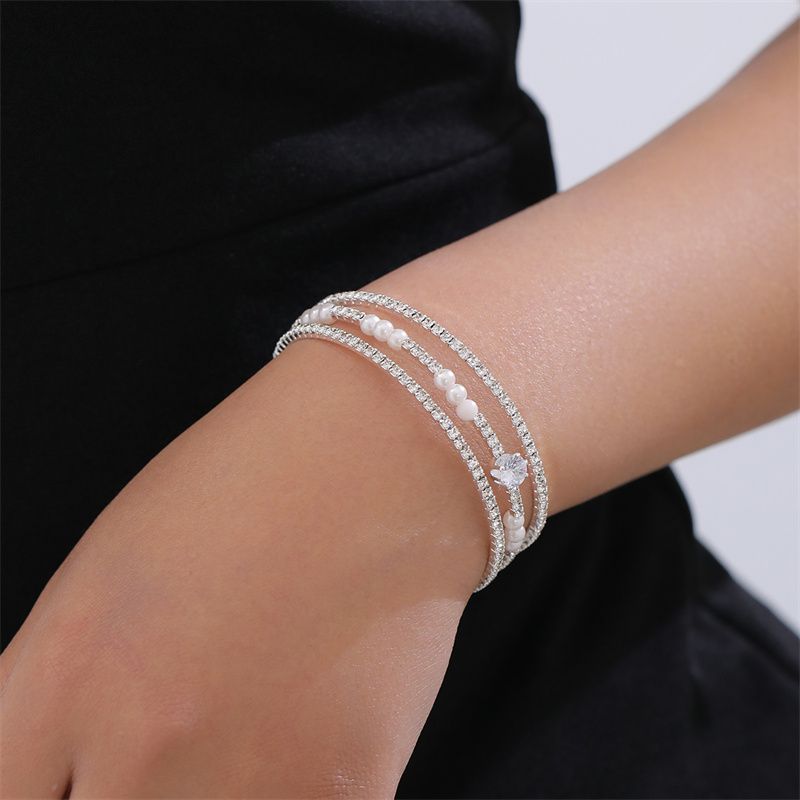 Simple Style Geometric Artificial Gemstones Artificial Pearl Zinc Alloy Layered Inlay Rhinestones Pearl Women's Wristband