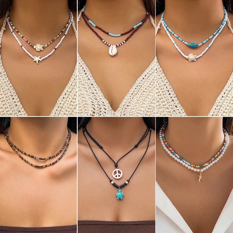 Großhandel Schmuck Einfacher Stil Klassischer Stil Farbblock Legierung Saatperle Perlen Geschichtete Halskette